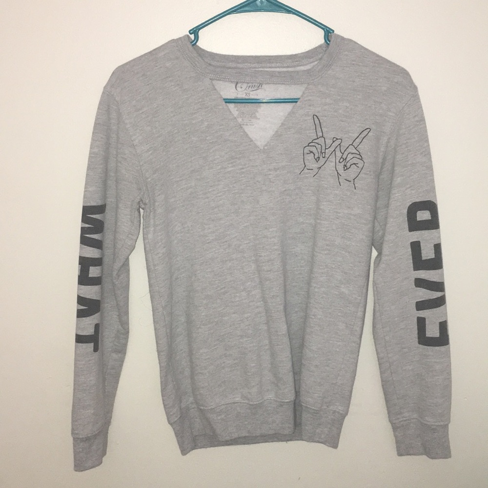 a long sleeve grey shirt.